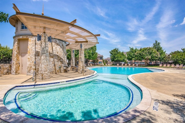 view of swimming pool featuring a patio