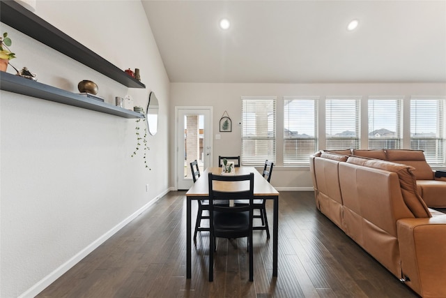 dining room featuring a wealth of natural light, dark wood finished floors, lofted ceiling, and baseboards