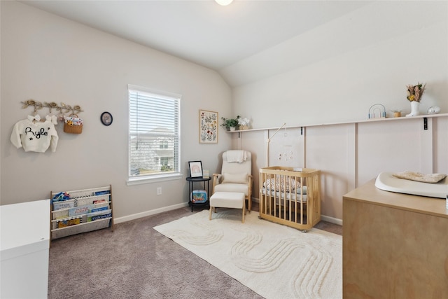 sitting room featuring carpet flooring, vaulted ceiling, and baseboards