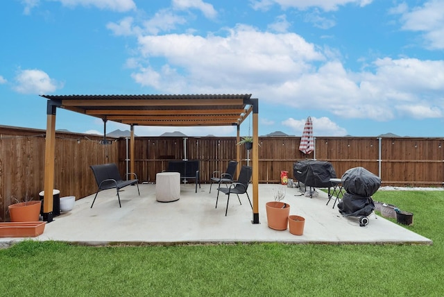 view of patio featuring a fenced backyard, a grill, and a pergola