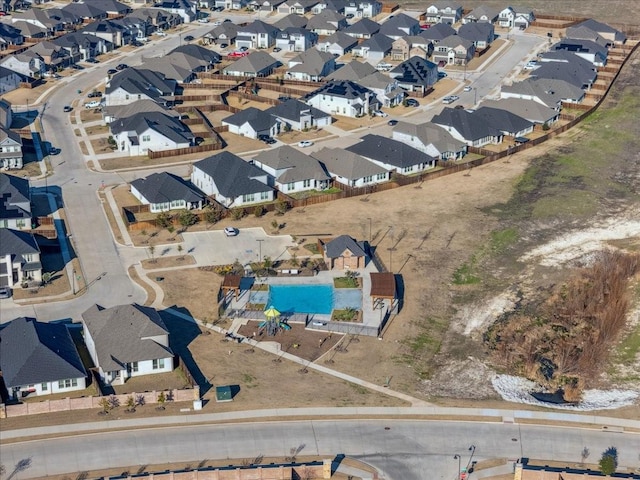 birds eye view of property with a residential view