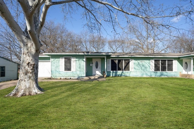 single story home with a garage and a front yard