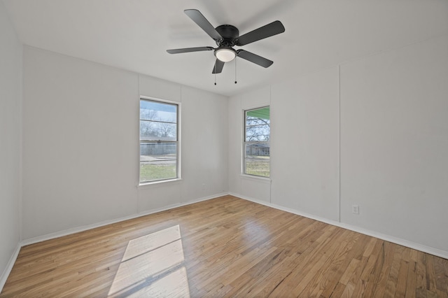 unfurnished room with ceiling fan and light hardwood / wood-style floors