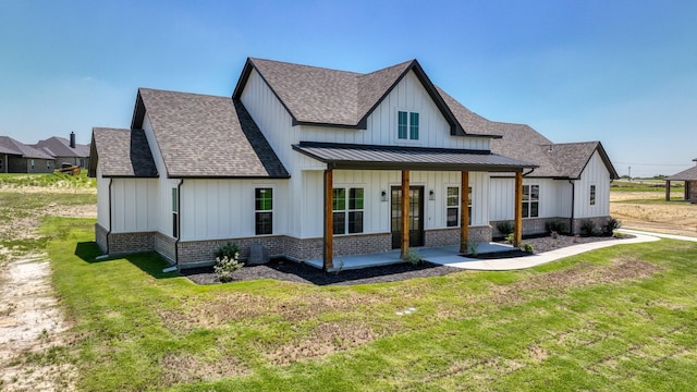 view of front facade featuring board and batten siding and a shingled roof