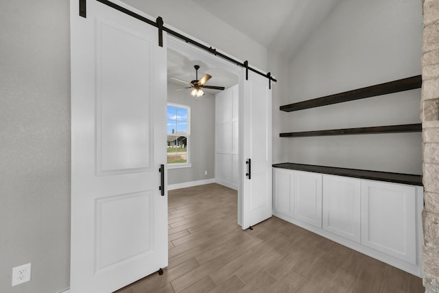 422 Collum Vw, Azle, TX 76020 - entryway with a barn door, light wood-style flooring, baseboards, a ceiling fan, and vaulted ceiling