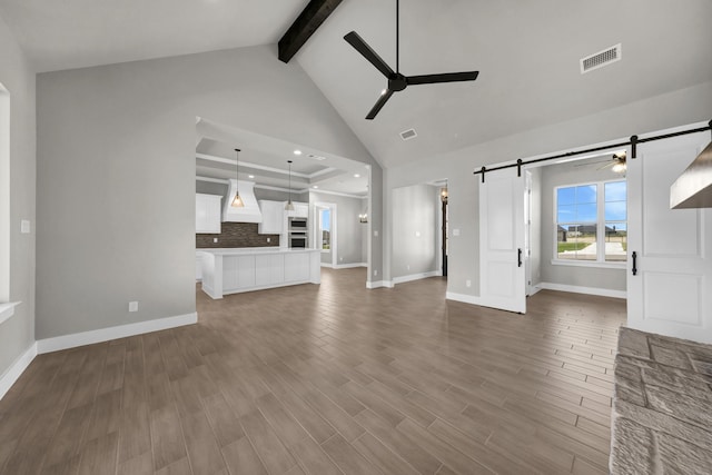 422 Collum Vw, Azle, TX 76020 - unfurnished living room featuring ceiling fan, a barn door, beam ceiling, baseboards, and high vaulted ceiling