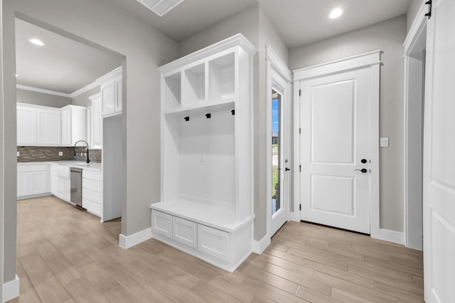 422 Collum Vw, Azle, TX 76020 - mudroom with light wood finished floors, recessed lighting, baseboards, and a sink