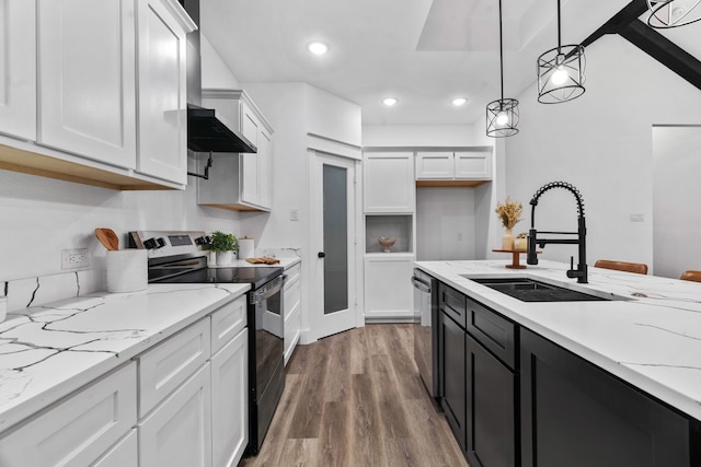 kitchen with decorative light fixtures, white cabinetry, wood-type flooring, sink, and stainless steel appliances