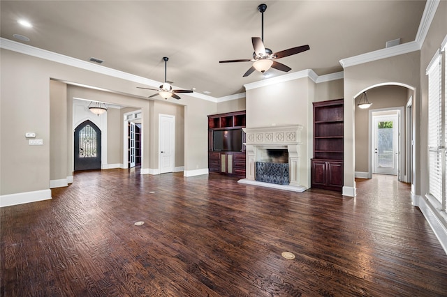 105 Zephyr Ct, Aurora, TX 76078 - unfurnished living room with a fireplace with raised hearth, ceiling fan, visible vents, arched walkways, and wood finished floors