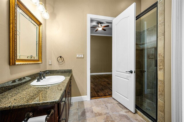 105 Zephyr Ct, Aurora, TX 76078 - full bathroom featuring stone finish flooring, ceiling fan, vanity, baseboards, and a stall shower