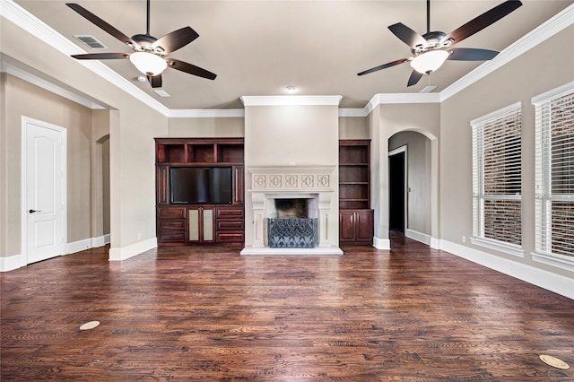 105 Zephyr Ct, Aurora, TX 76078 - unfurnished living room with arched walkways, ceiling fan, wood finished floors, and crown molding