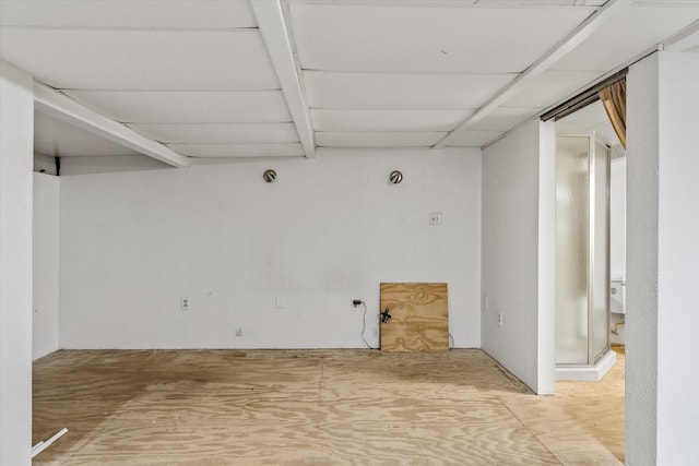 basement featuring a paneled ceiling