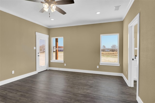 empty room with ornamental molding, dark hardwood / wood-style floors, and ceiling fan