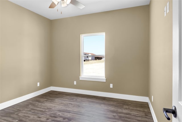 spare room with ceiling fan and dark hardwood / wood-style flooring