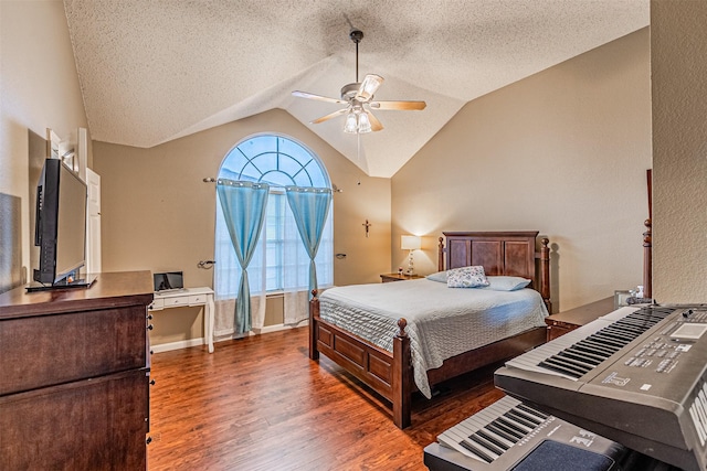 bedroom featuring vaulted ceiling, ceiling fan, a textured ceiling, and dark hardwood / wood-style flooring