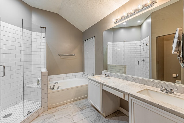 bathroom with vaulted ceiling, shower with separate bathtub, vanity, and a textured ceiling