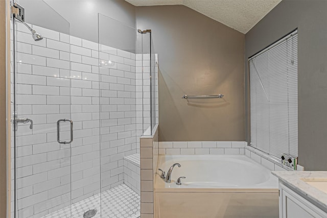 bathroom featuring vanity, vaulted ceiling, a textured ceiling, and plus walk in shower