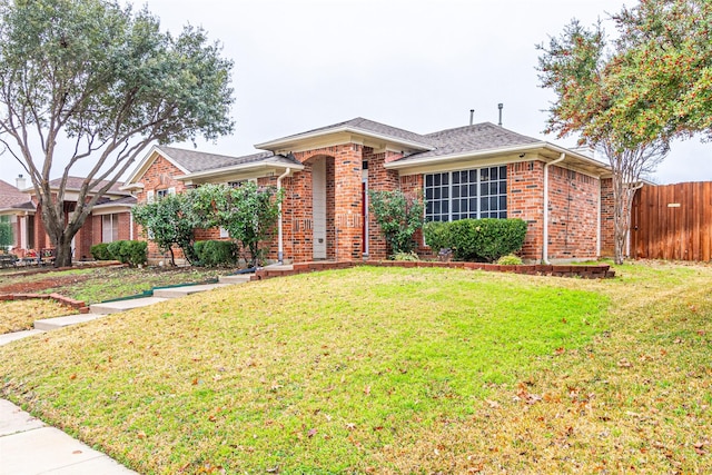 single story home with a front lawn