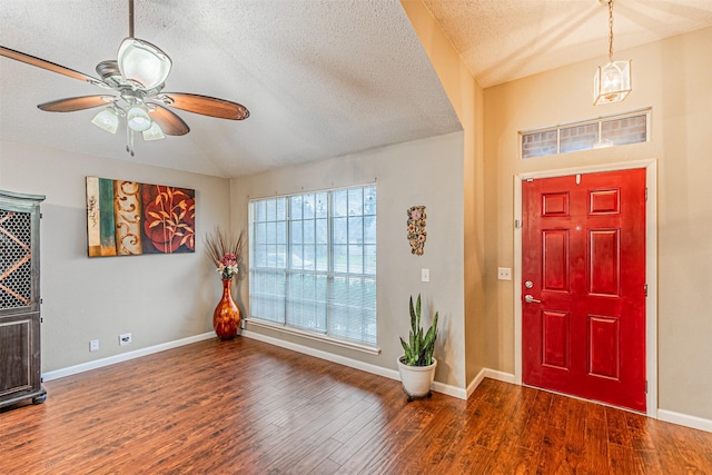 entrance foyer with ceiling fan, dark hardwood / wood-style floors, and a textured ceiling