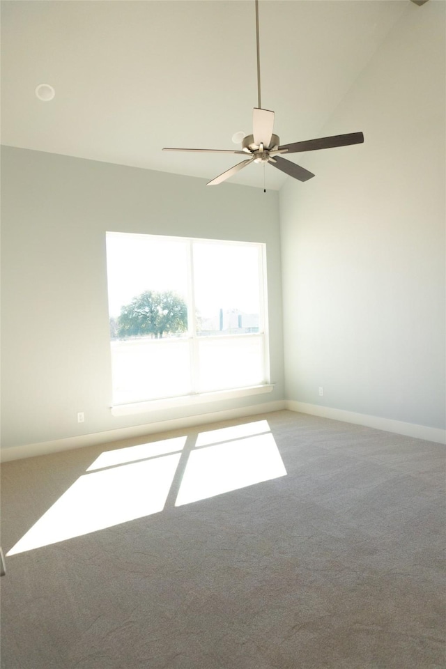 unfurnished room with carpet, ceiling fan, and baseboards