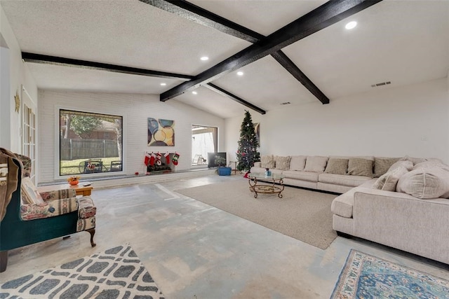 living room featuring concrete flooring, lofted ceiling with beams, and a textured ceiling