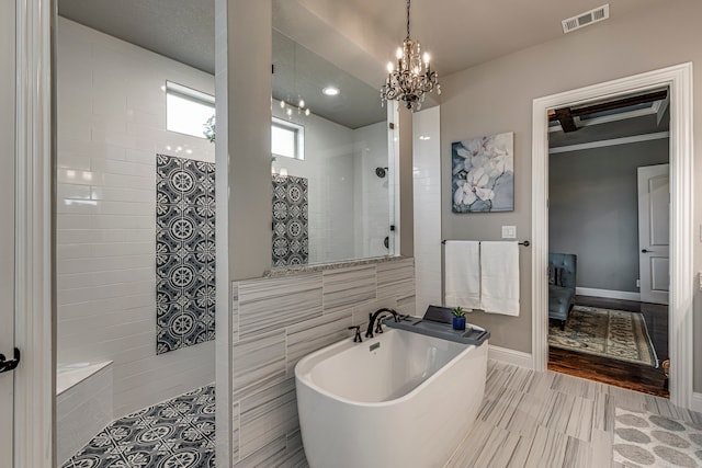 bathroom featuring separate shower and tub