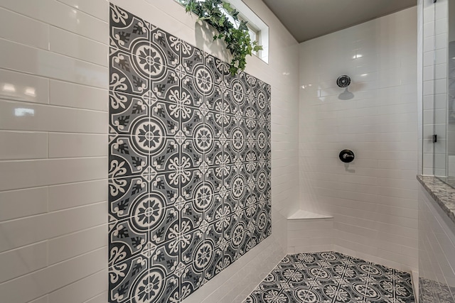 bathroom with tiled shower