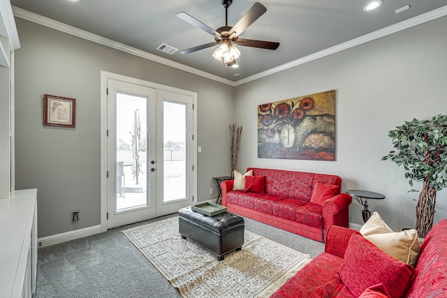 living room featuring crown molding, french doors, and carpet