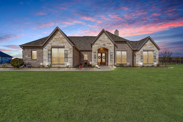 view of front of home with a lawn