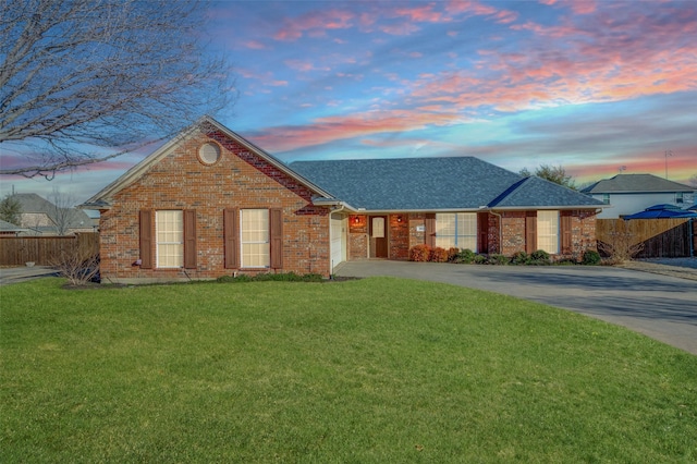 view of front of house with a yard