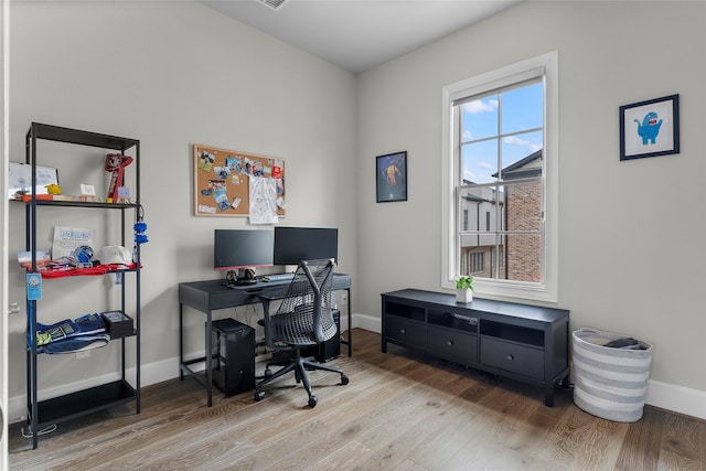 office space with hardwood / wood-style flooring
