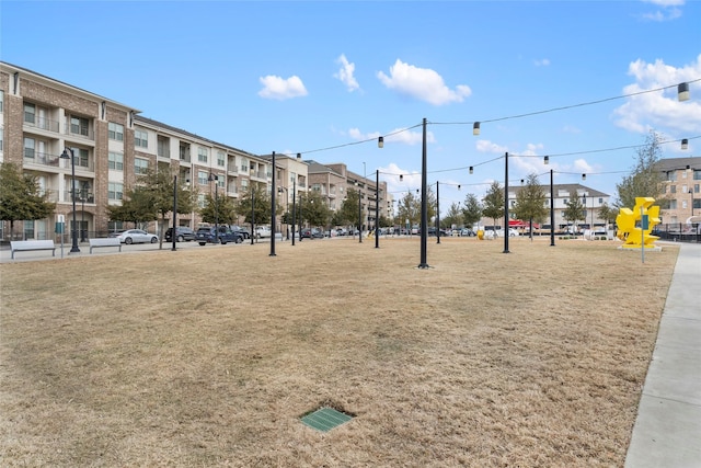 view of home's community with a lawn