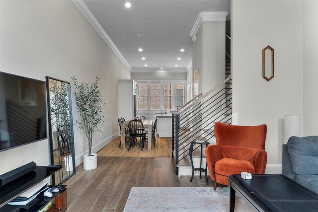 interior space with hardwood / wood-style flooring and crown molding