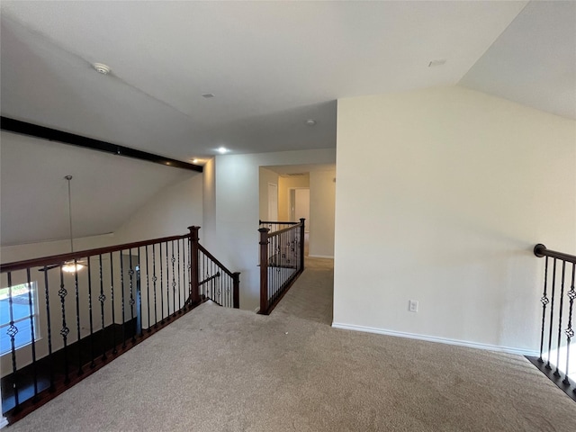 empty room featuring lofted ceiling and dark carpet