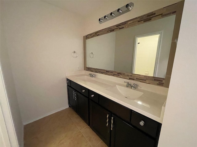 bathroom featuring vanity, tile patterned flooring, and decorative backsplash