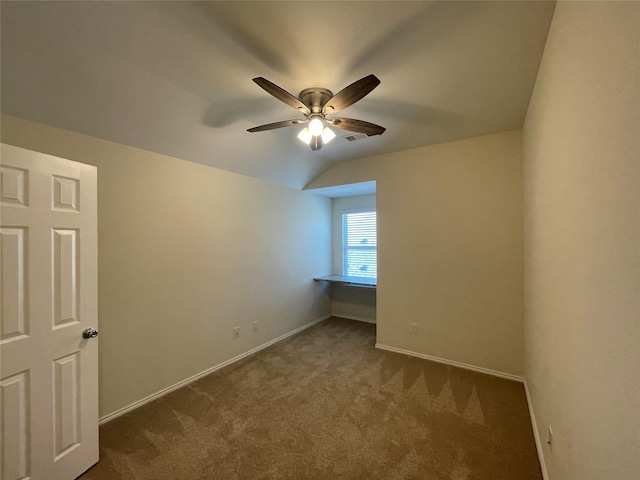 interior space featuring ceiling fan and lofted ceiling