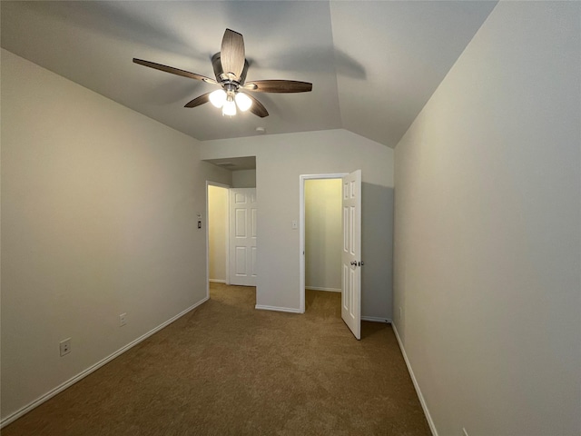 unfurnished bedroom with vaulted ceiling, carpet floors, and ceiling fan