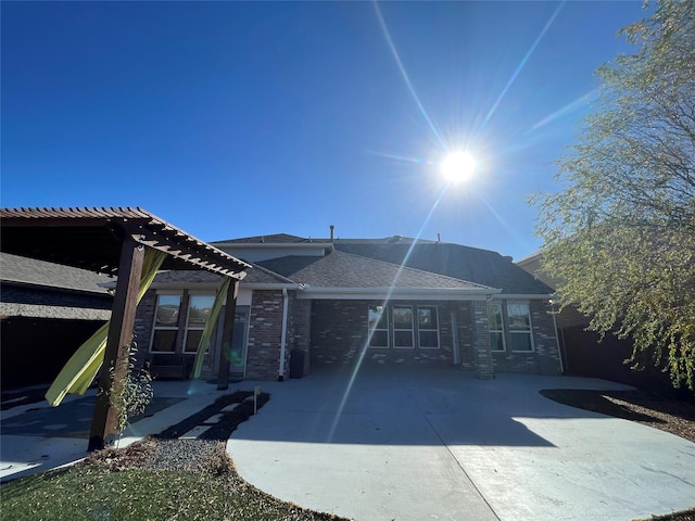 back of house featuring a pergola and a patio