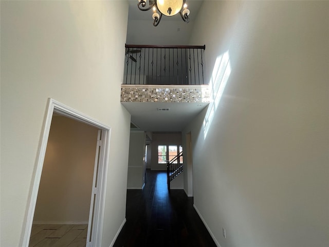 corridor featuring a high ceiling