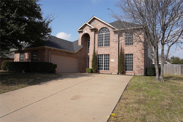 view of front of property with a garage and a front yard