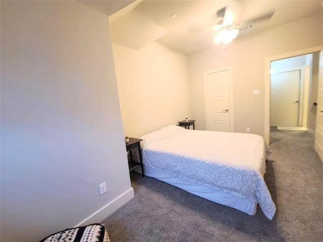 bedroom featuring ceiling fan and dark carpet