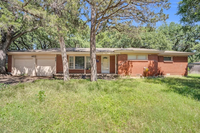 ranch-style house featuring a garage and a front yard