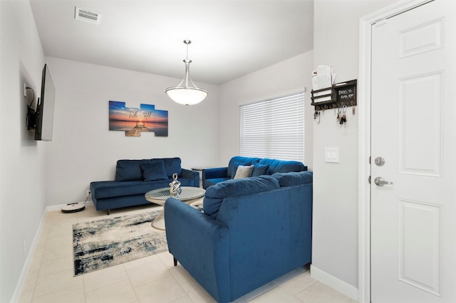 living room with light tile patterned floors