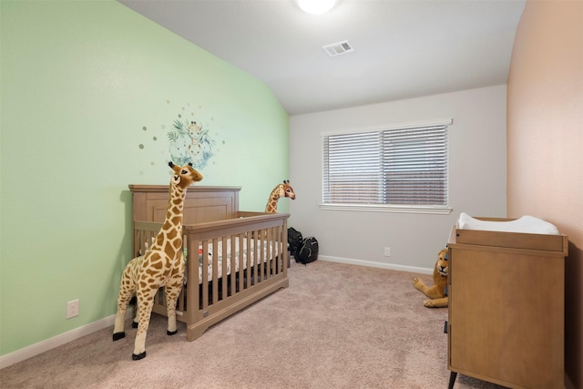 carpeted bedroom with vaulted ceiling