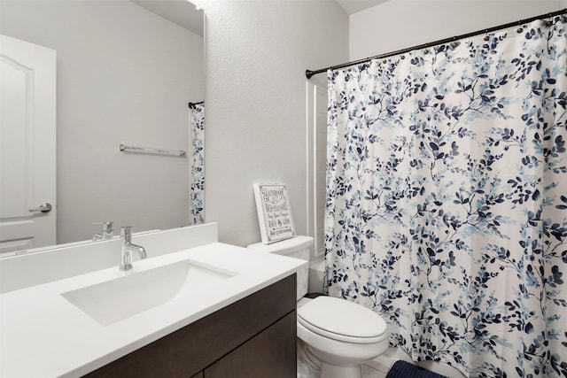 bathroom with vanity, toilet, and curtained shower