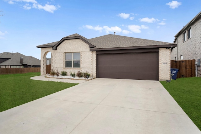 single story home featuring a garage and a front lawn