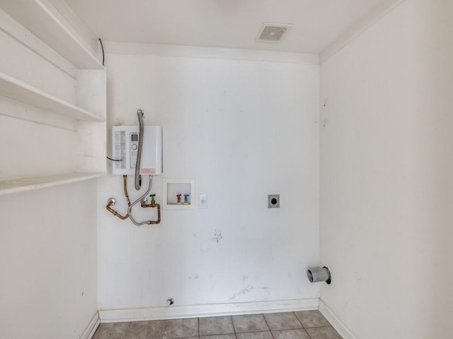 laundry room with electric dryer hookup, washer hookup, water heater, and light tile patterned flooring