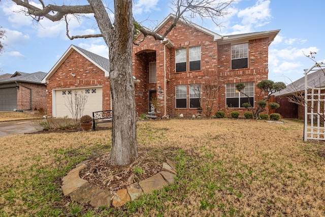 front of property featuring a garage and a front lawn