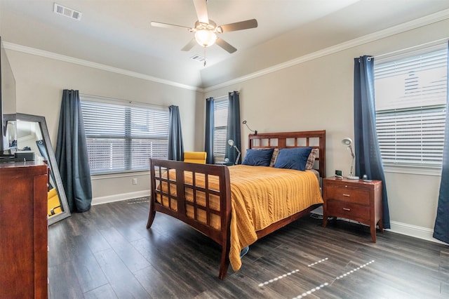 bedroom with crown molding, ceiling fan, and dark hardwood / wood-style floors