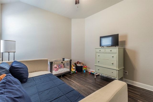 bedroom featuring lofted ceiling, dark wood-type flooring, and ceiling fan